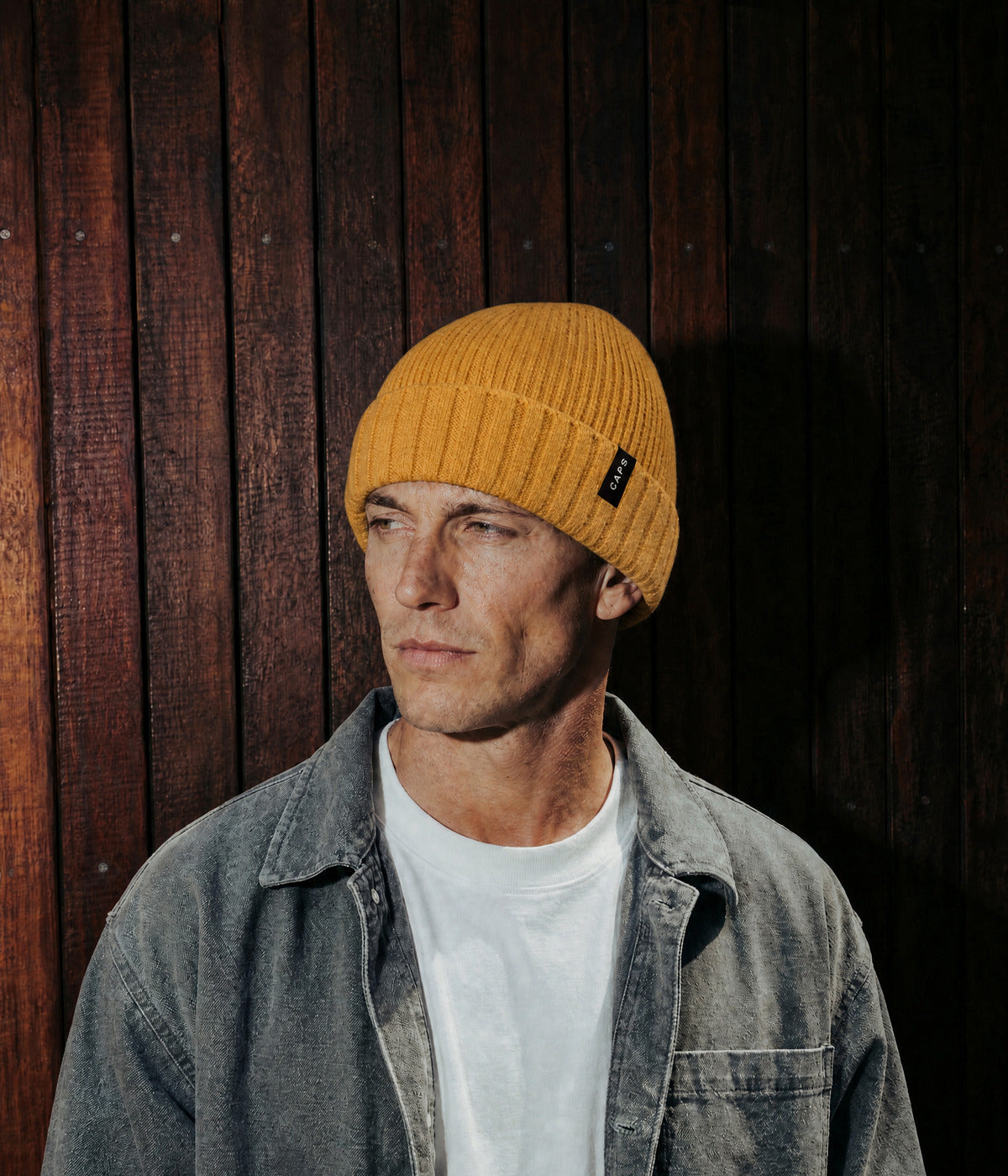 LOGO RIBBED BEANIE. — MUSTARD YELLOW worn