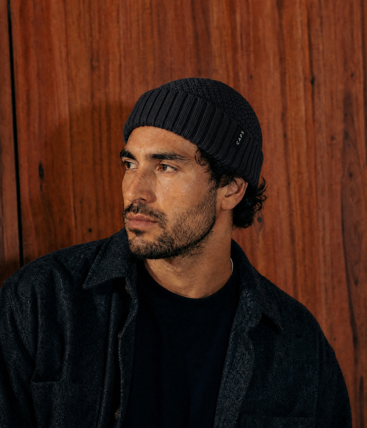 LOGO RIBBED FISHERMAN BEANIE. — BLACK worn
