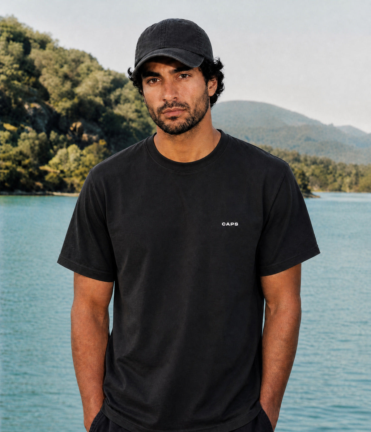 LOGO TEE. BLACK worn by a man