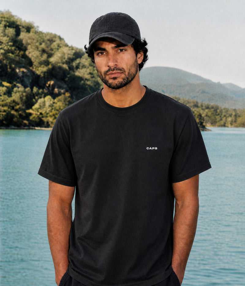 LOGO TEE. BLACK worn by a man