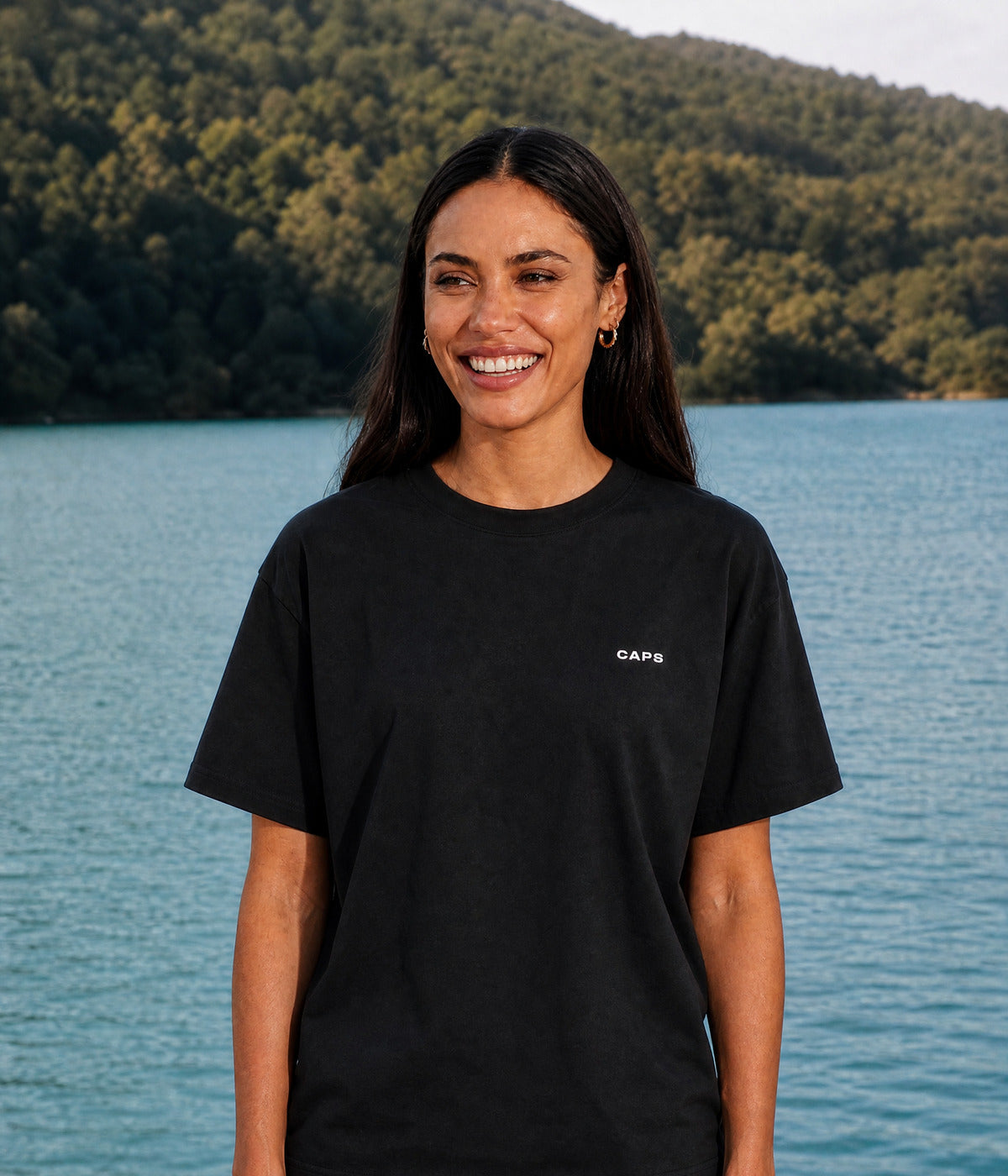 LOGO TEE. BLACK worn by a woman