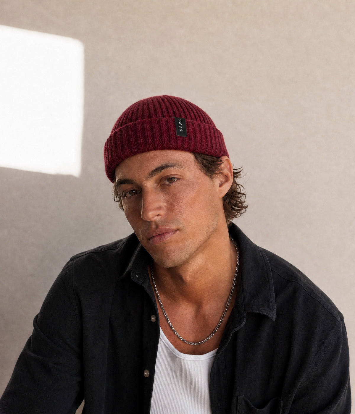 LOGO WOOL FISHERMAN BEANIE. — RED worn