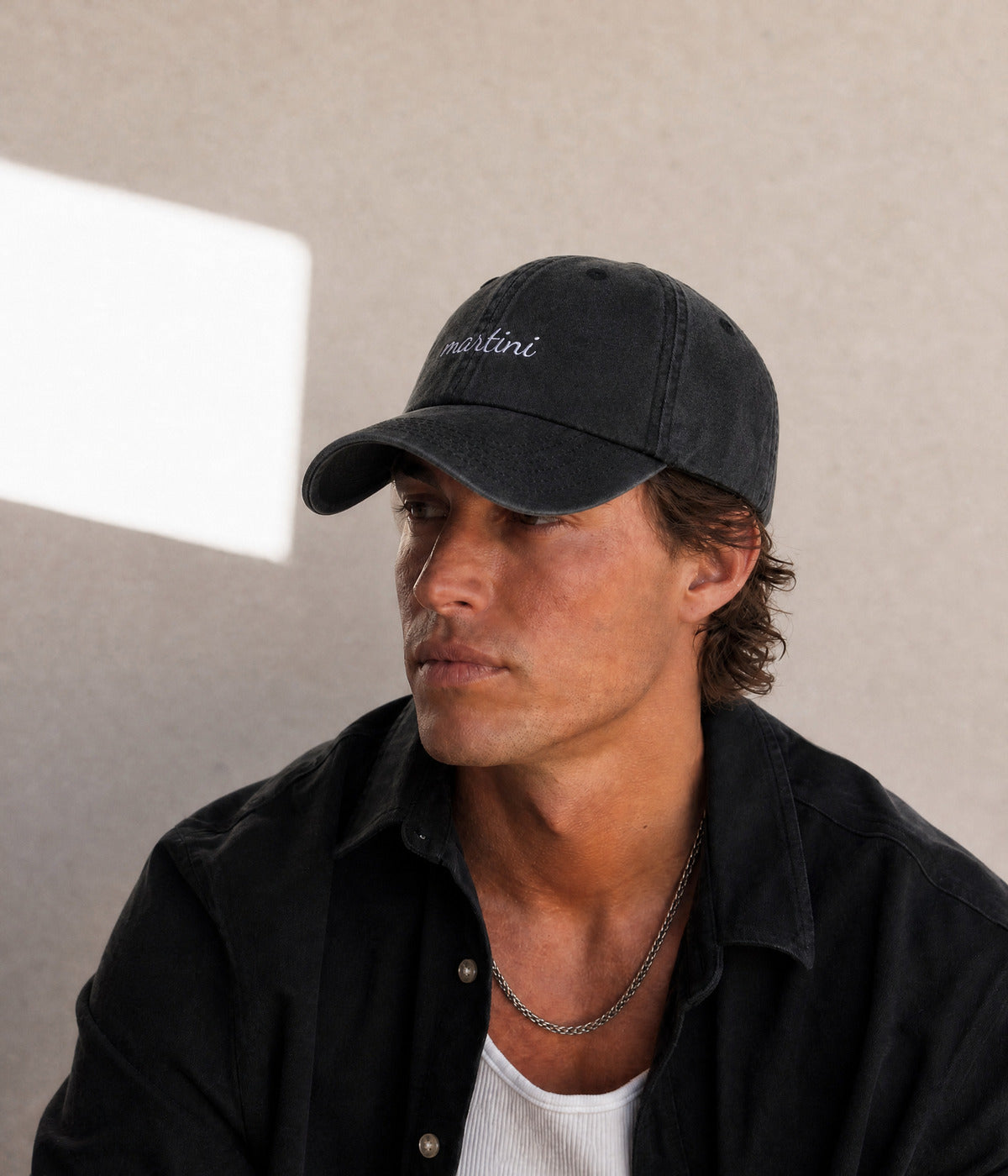 MARTINI - CURSIVE. BLACK worn by a man