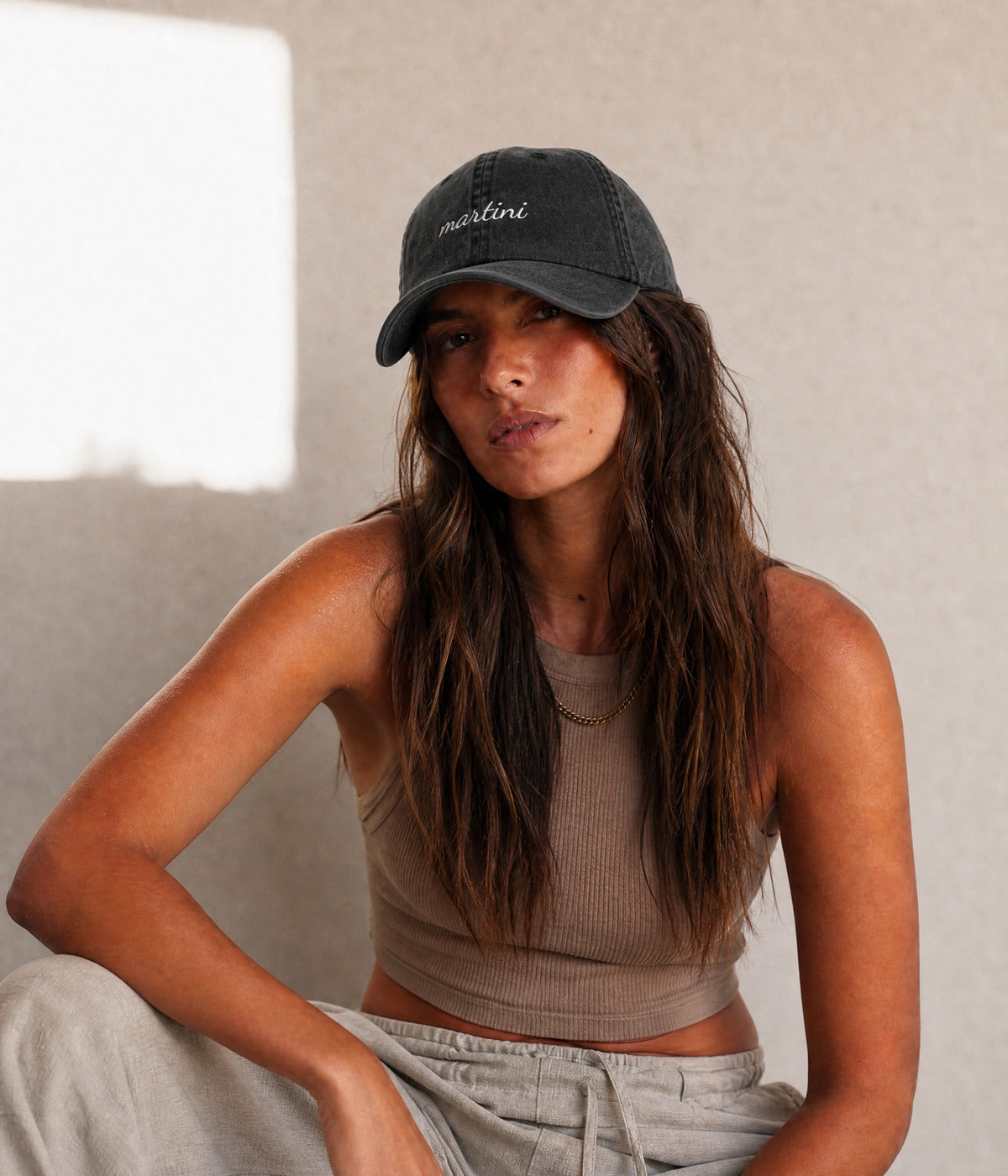MARTINI - CURSIVE. BLACK worn by a woman