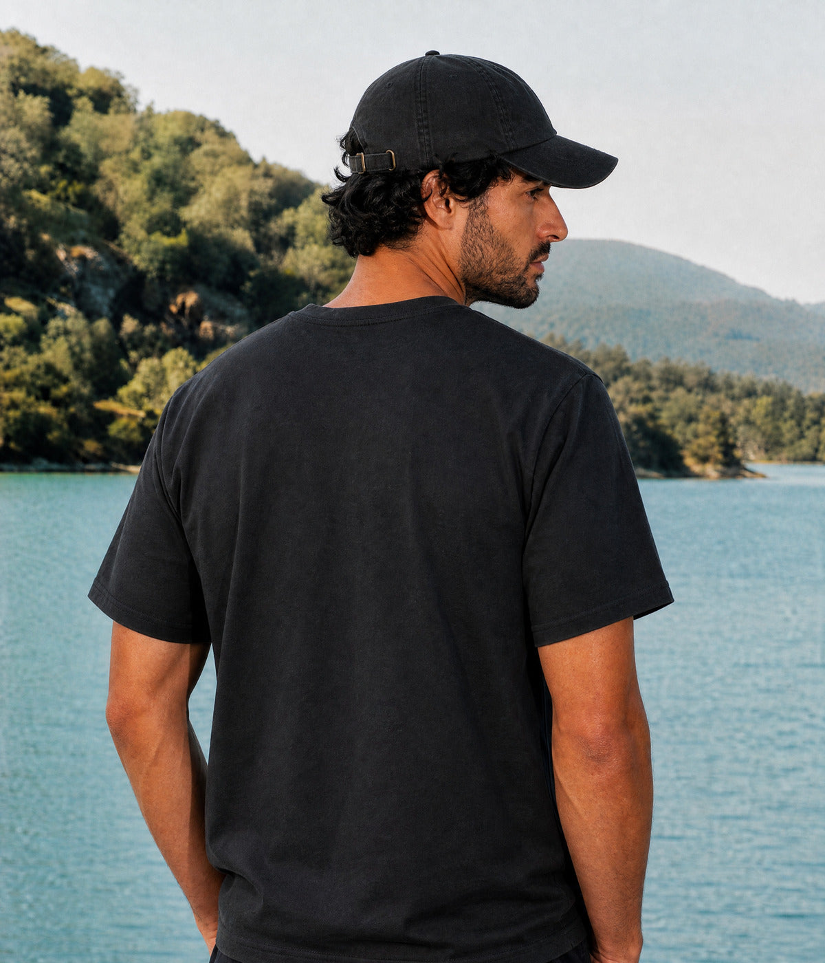 ROSE TEE. BLACK worn by a man, back view
