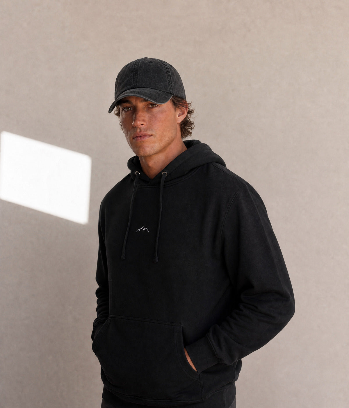 MOUNTAINS HOODIE. on model