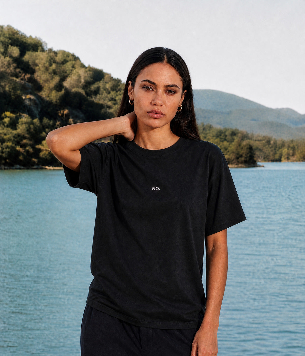 NO TEE. BLACK worn by a woman