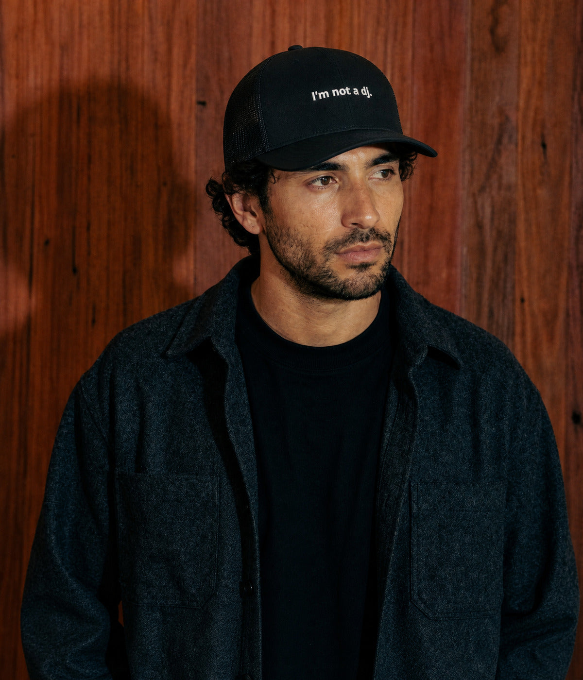 NOT A DJ TRUCKER. BLACK worn by a man