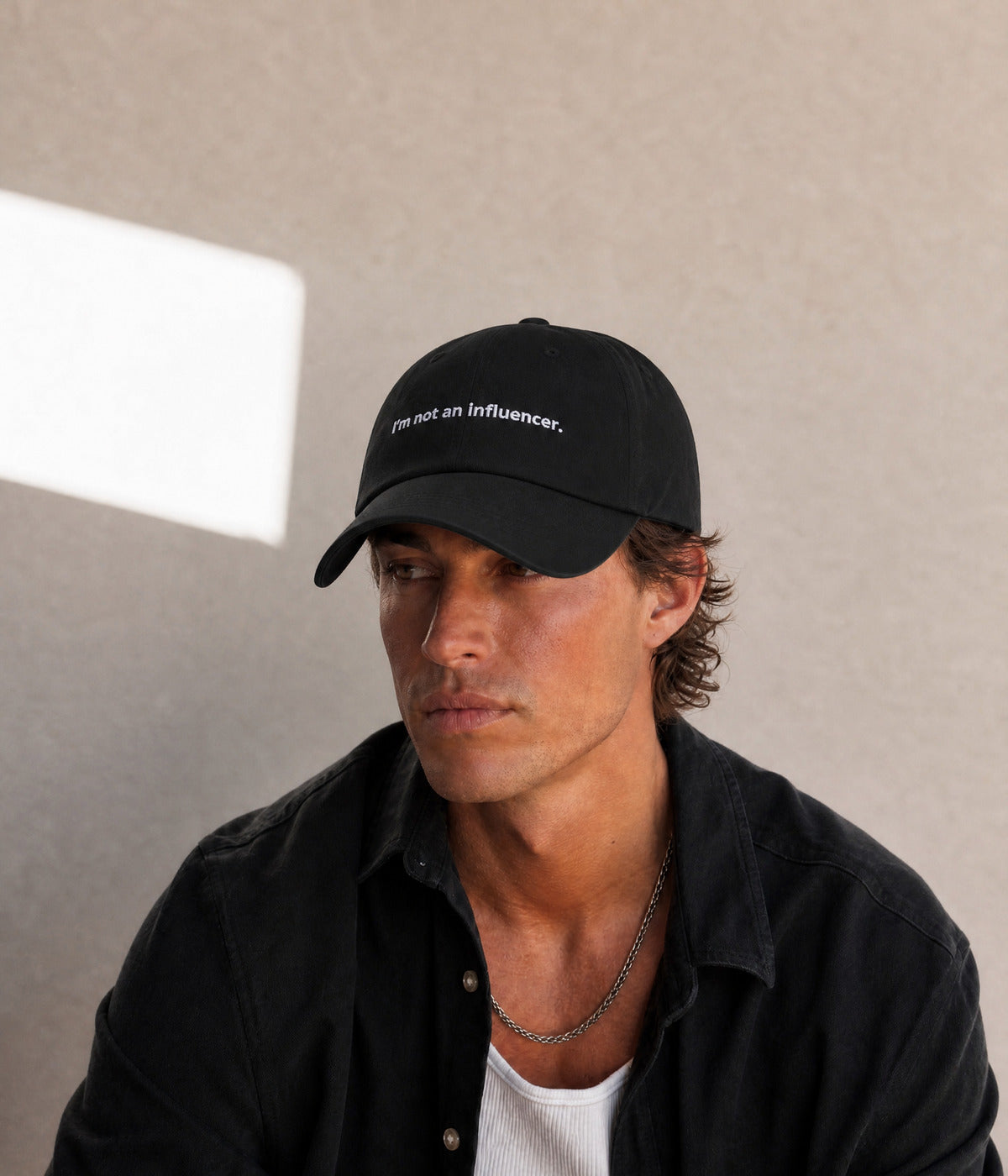 NOT AN INFLUENCER. worn by a man