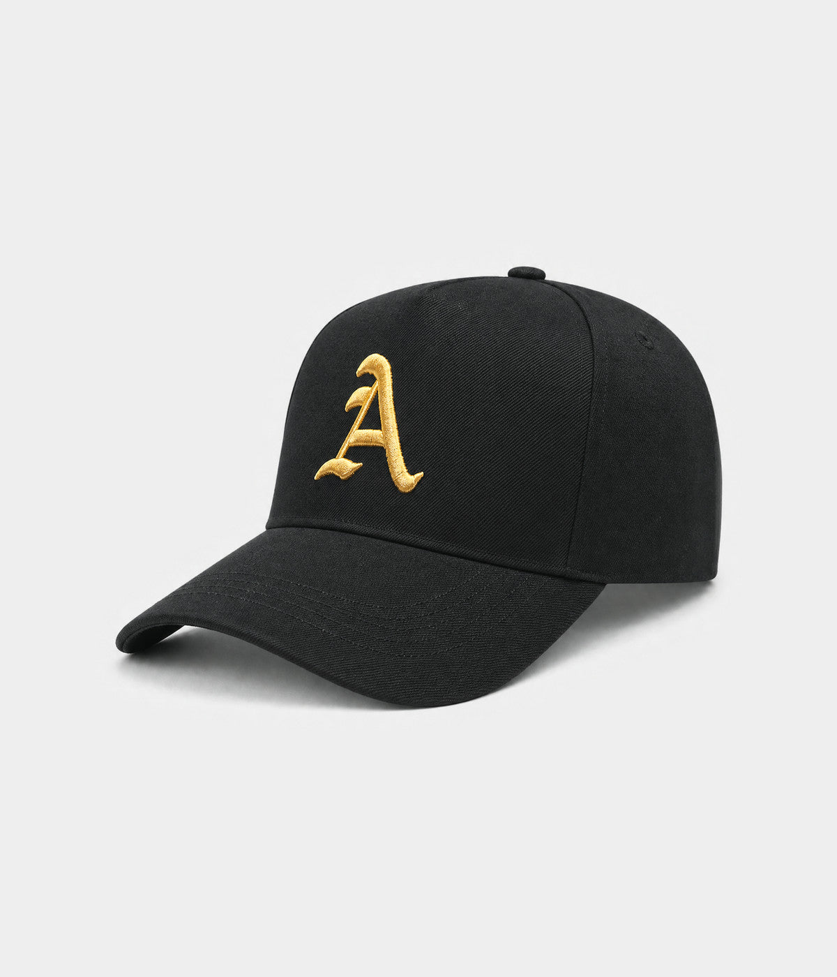 OLD ENGLISH A. cotton twill cap in black and gold, side view