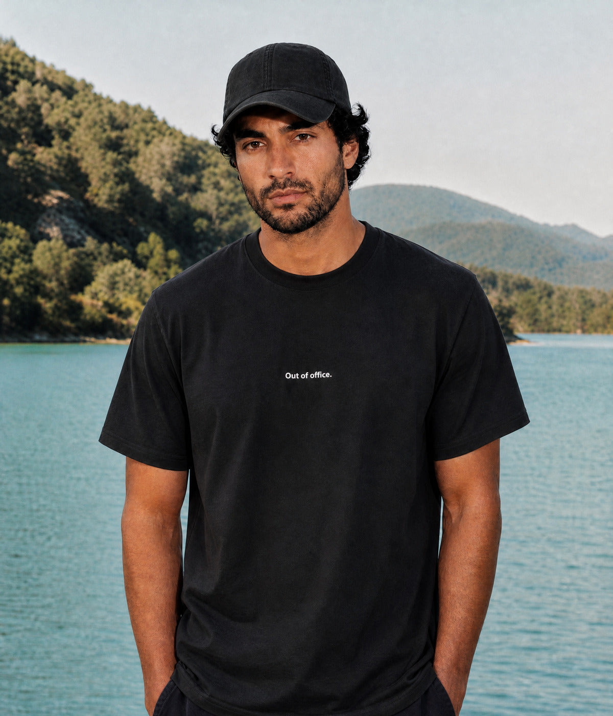 OUT OF OFFICE TEE. BLACK worn by a man