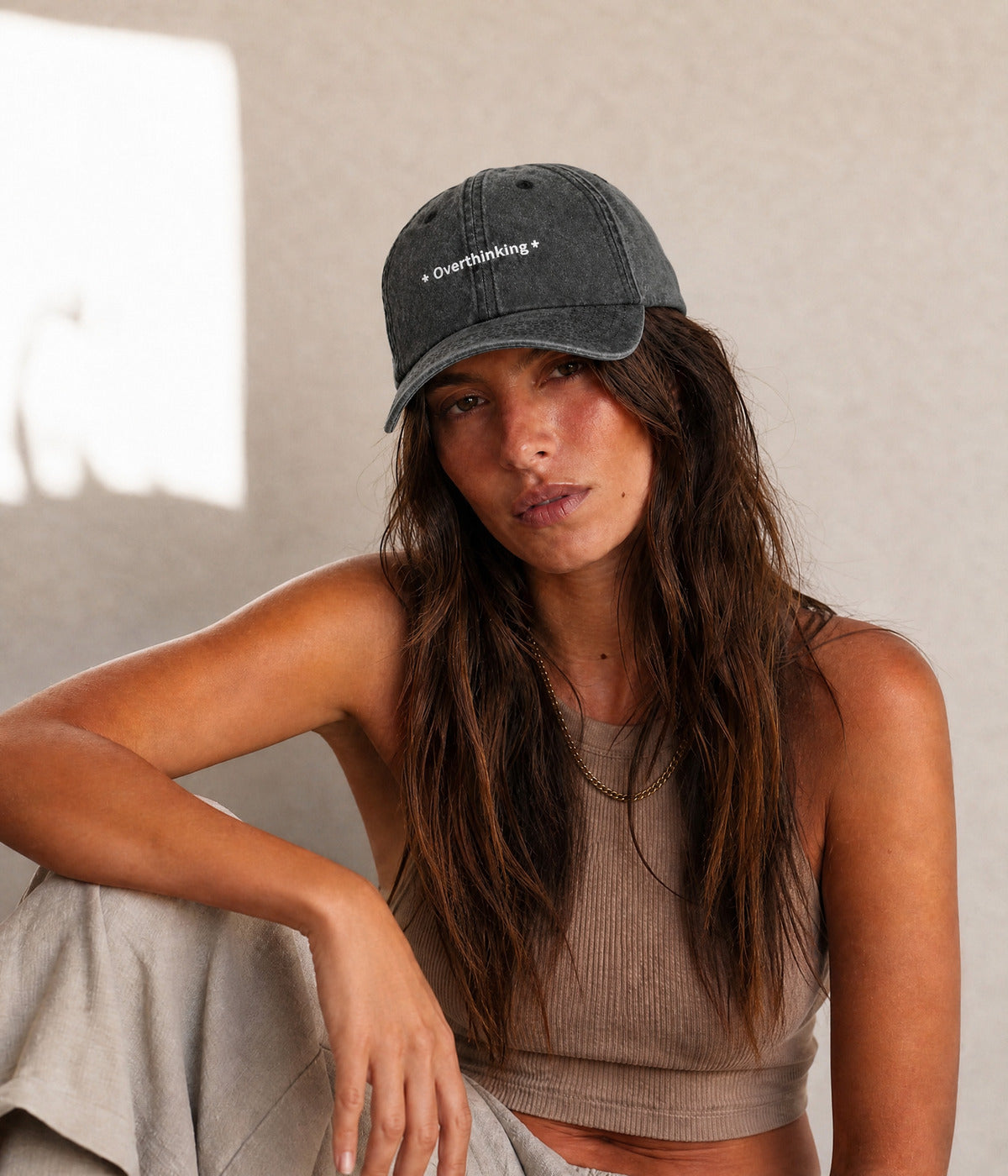 OVERTHINKING. BLACK worn by a woman