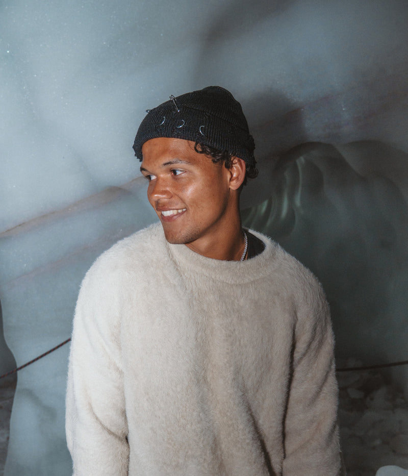PIERCED FISHERMAN BEANIE. — BLACK worn