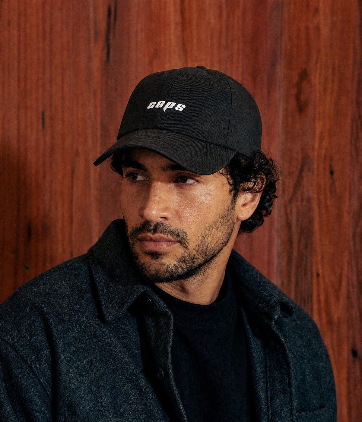 LOGO CAP. worn by a man