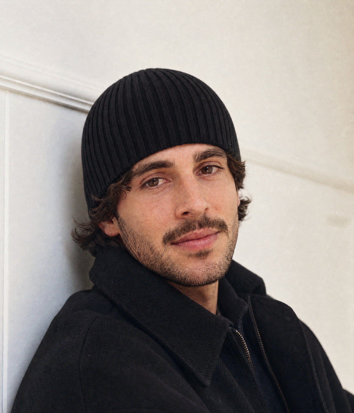 RIB KNIT BEANIE. — BLACK worn