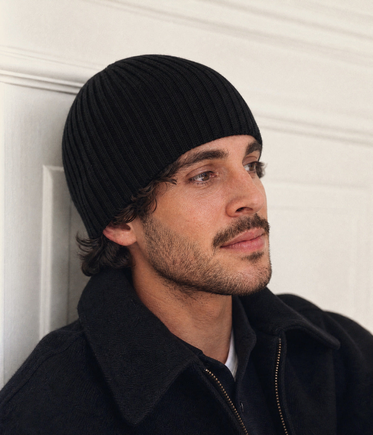 RIB KNIT BEANIE. — BLACK worn