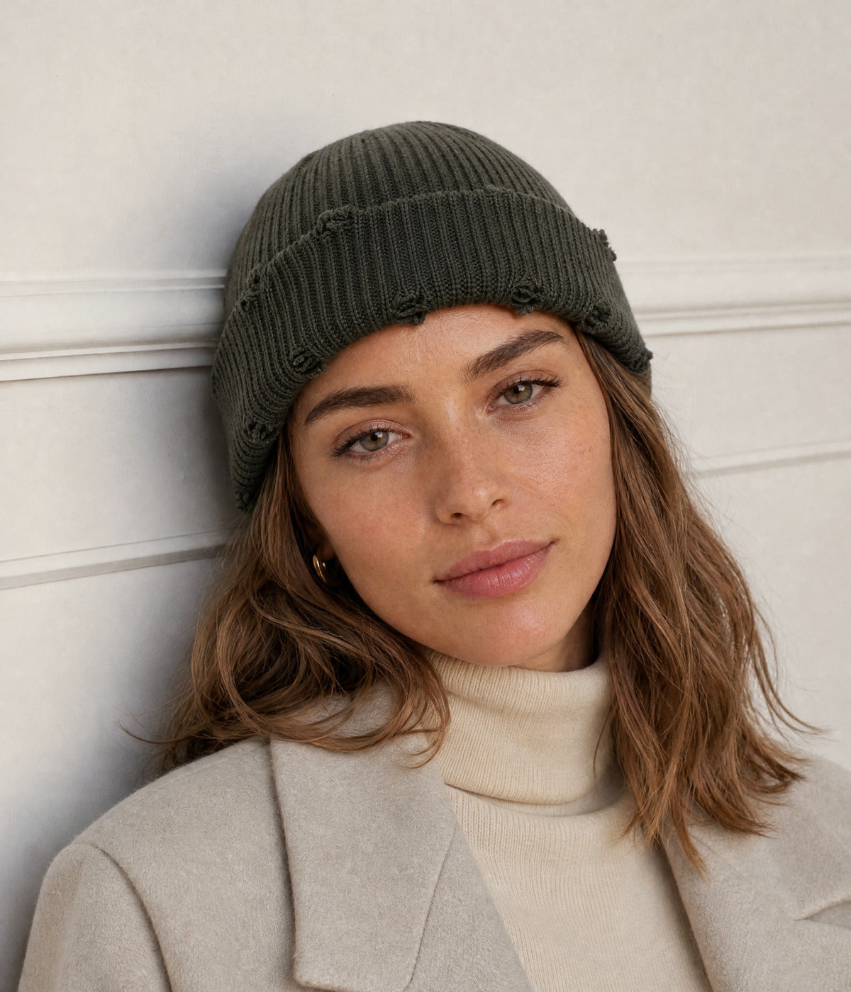 RIPPED FISHERMAN BEANIE. — DARK GREEN worn