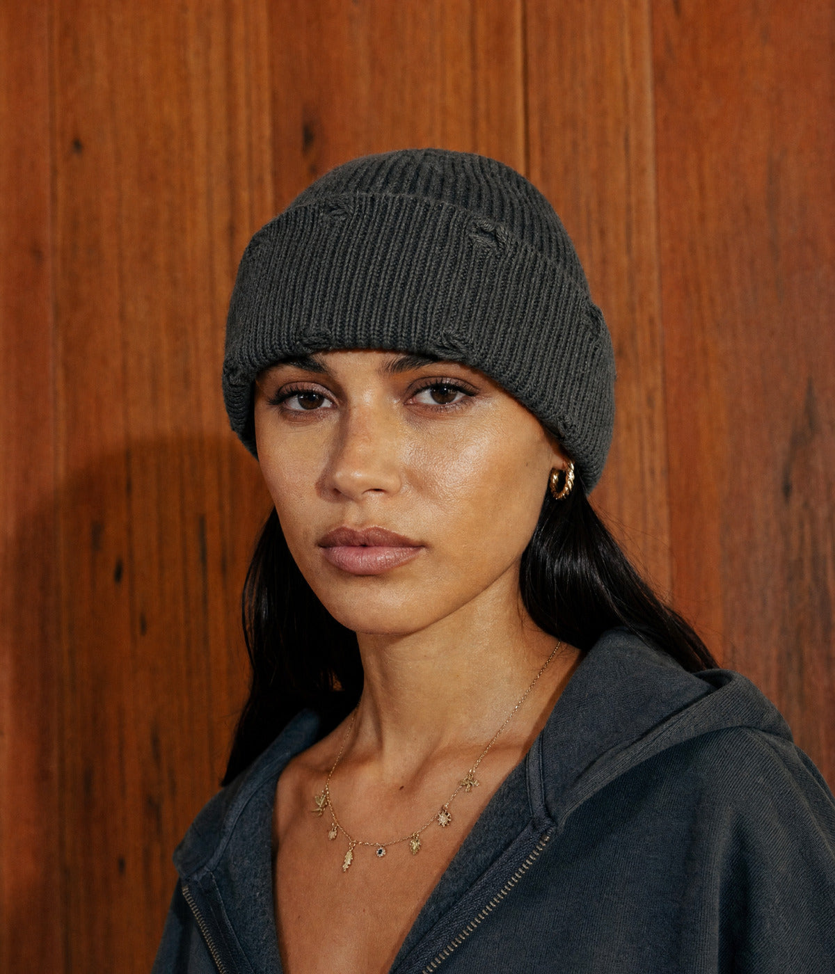 RIPPED FISHERMAN BEANIE. — DARK GREEN worn