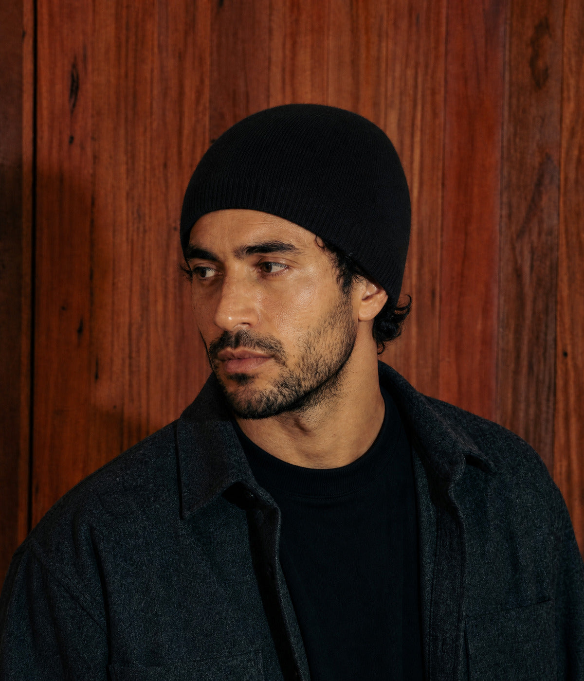SLIM FIT BEANIE. — BLACK worn