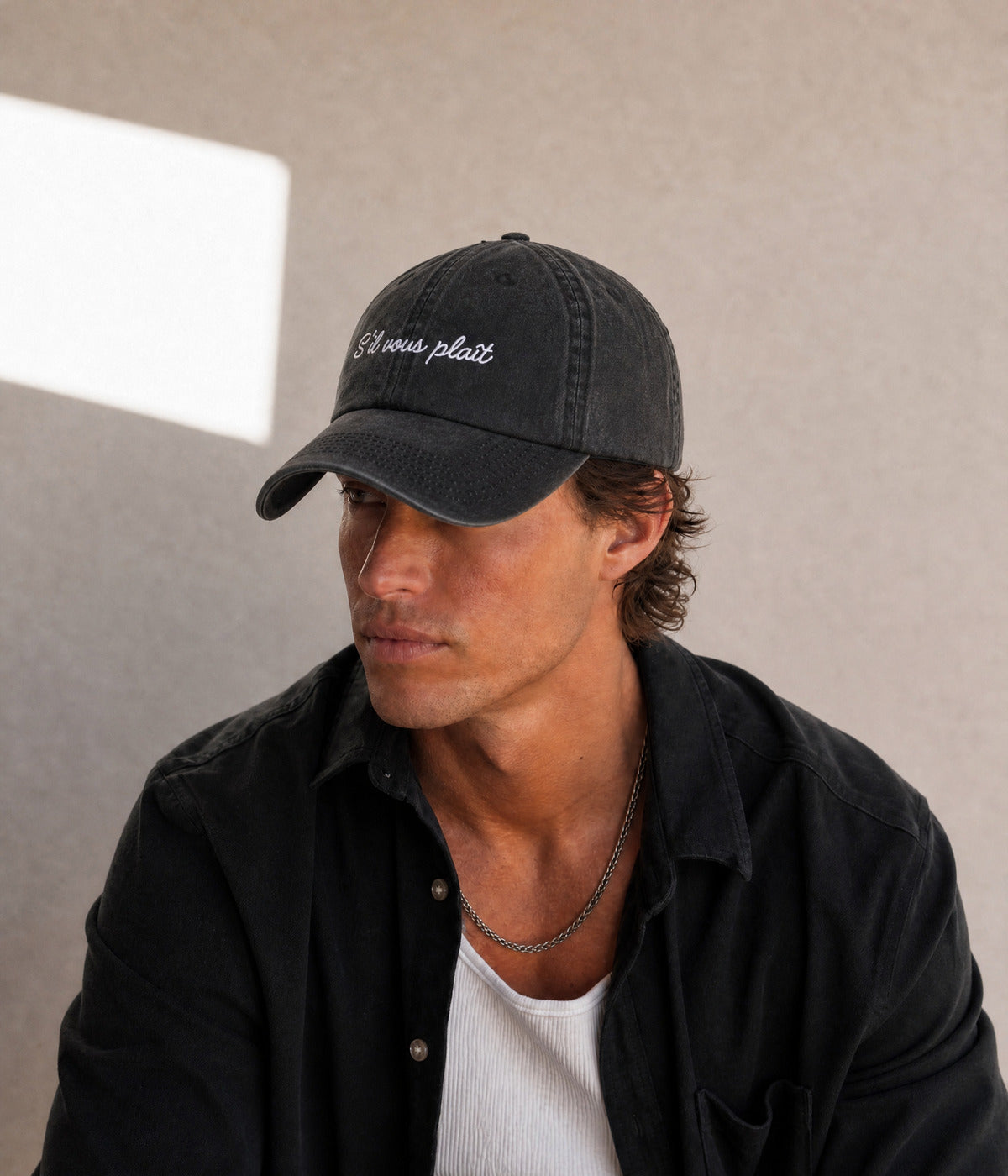 SVP - CURSIVE. worn by a man