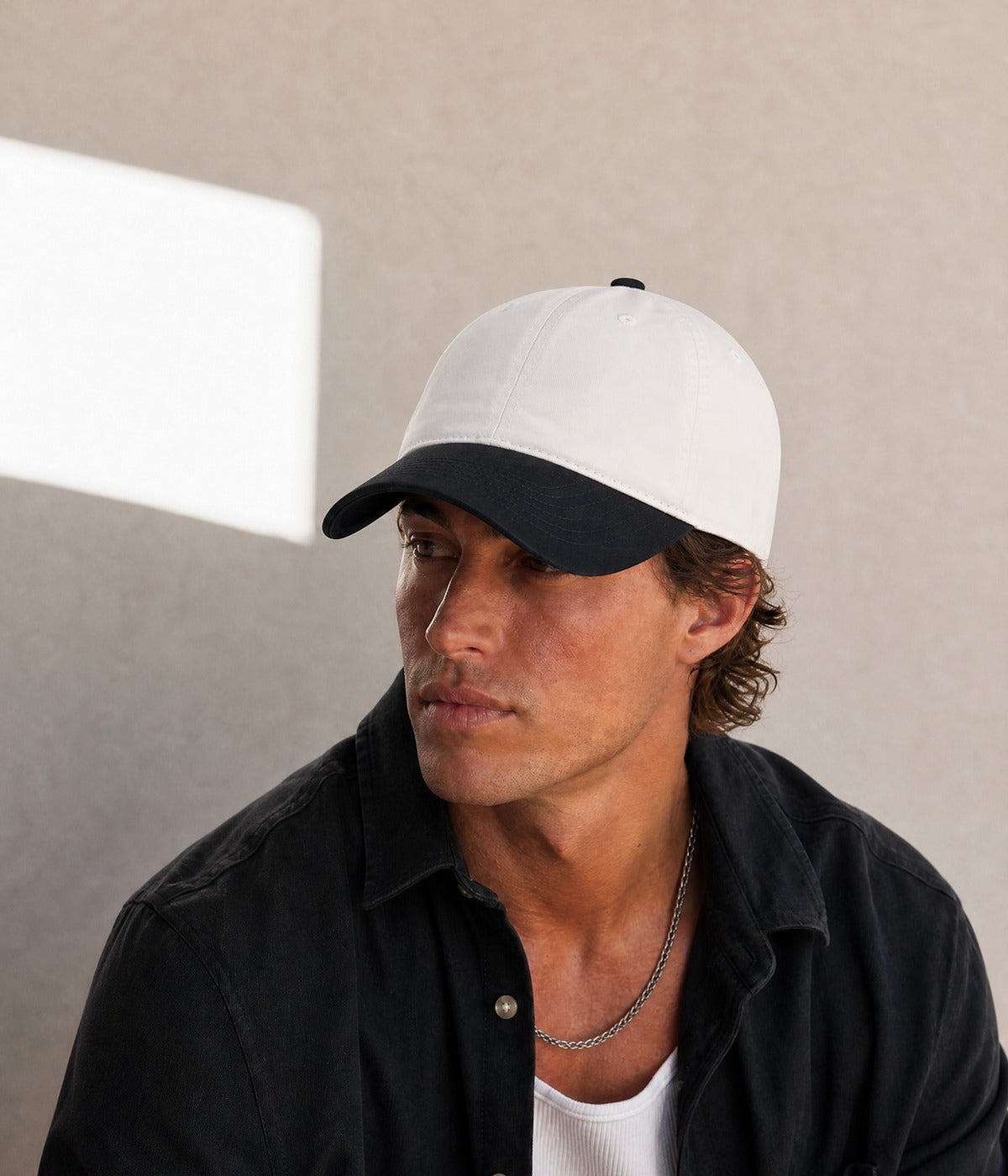 TWO TONE. BLACK worn by a man