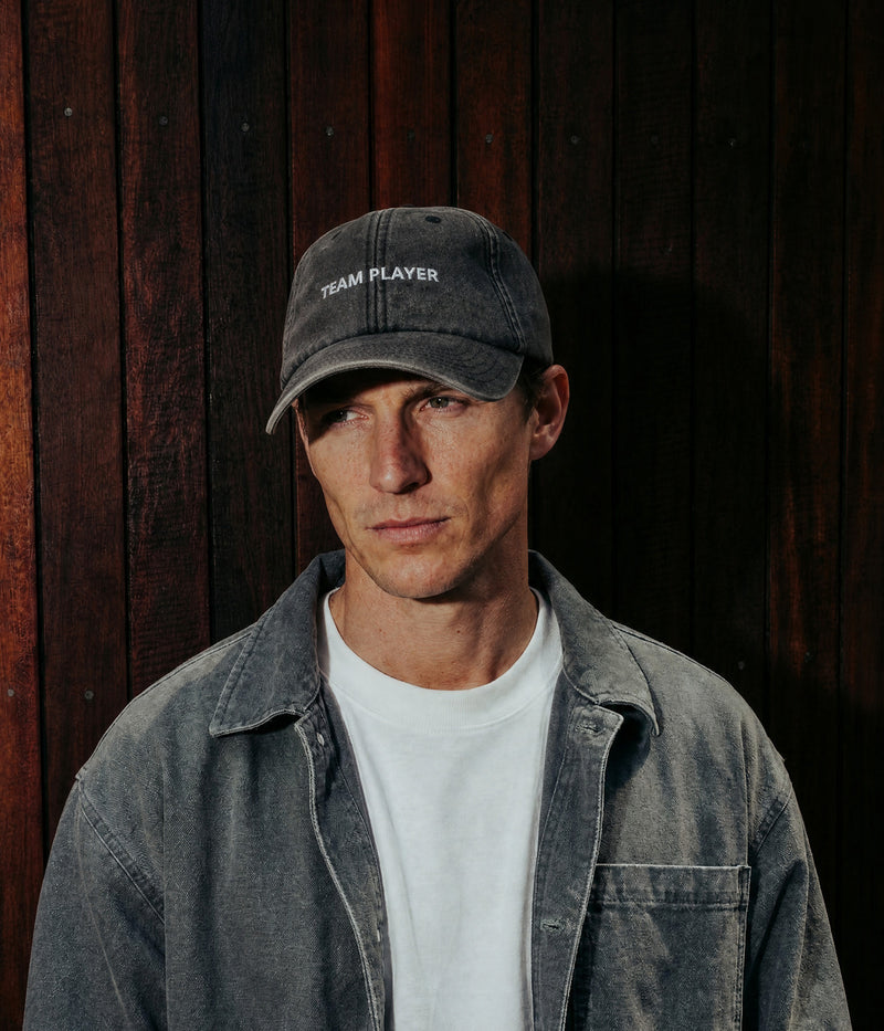 TEAM PLAYER. worn by a man