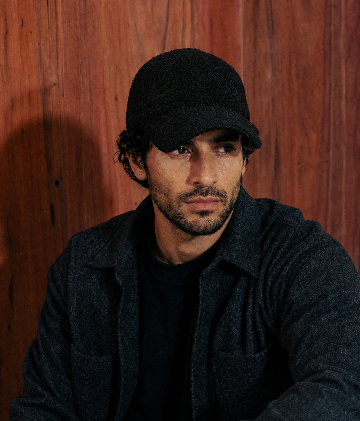 TEDDY CAP. BLACK worn by a man