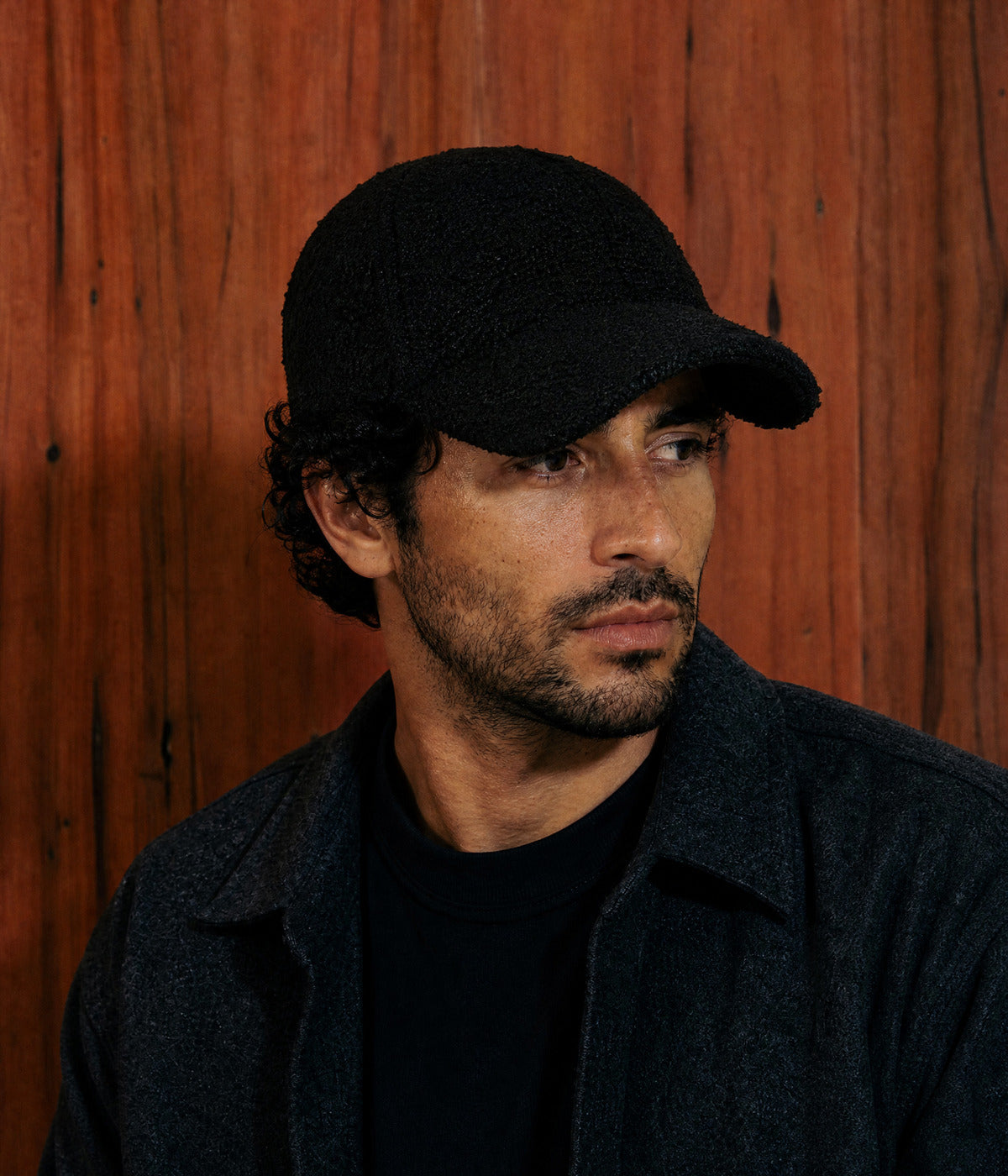 TEDDY CAP. BLACK worn by a man