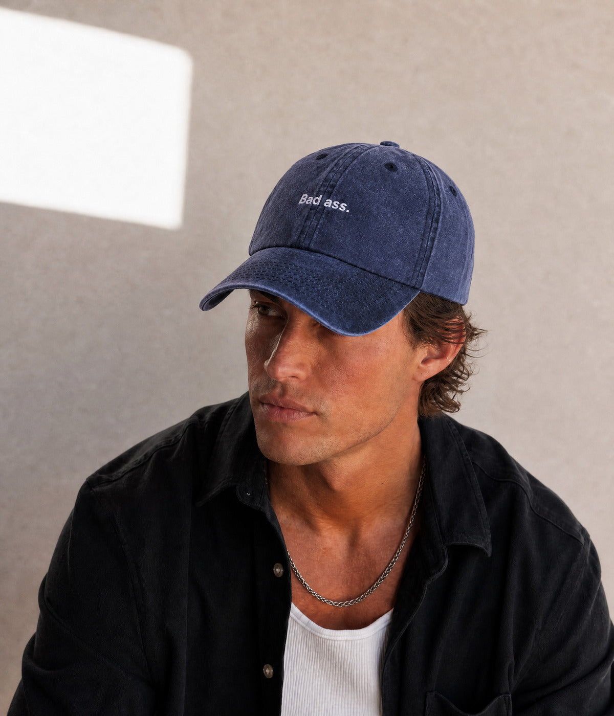 WASHED BAD ASS. NAVY worn by a man