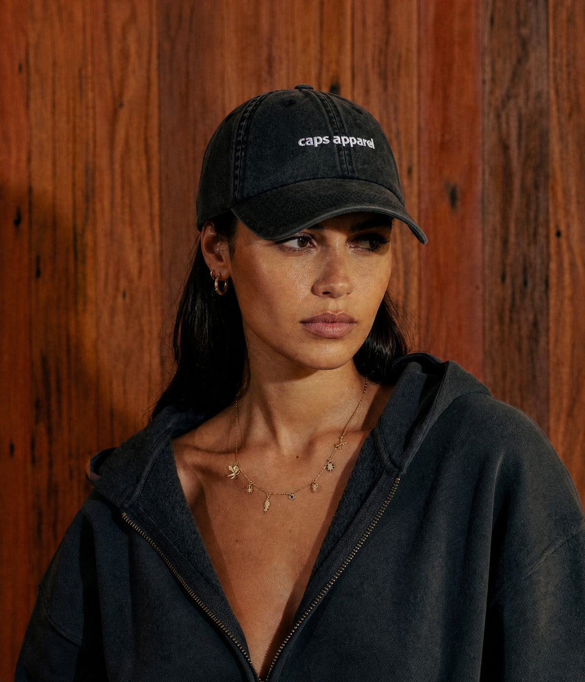 WASHED CAPS APPAREL. worn by a woman