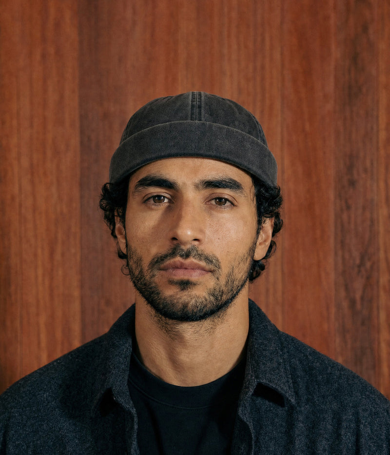 WASHED FISHERMAN BEANIE. — BLACK worn