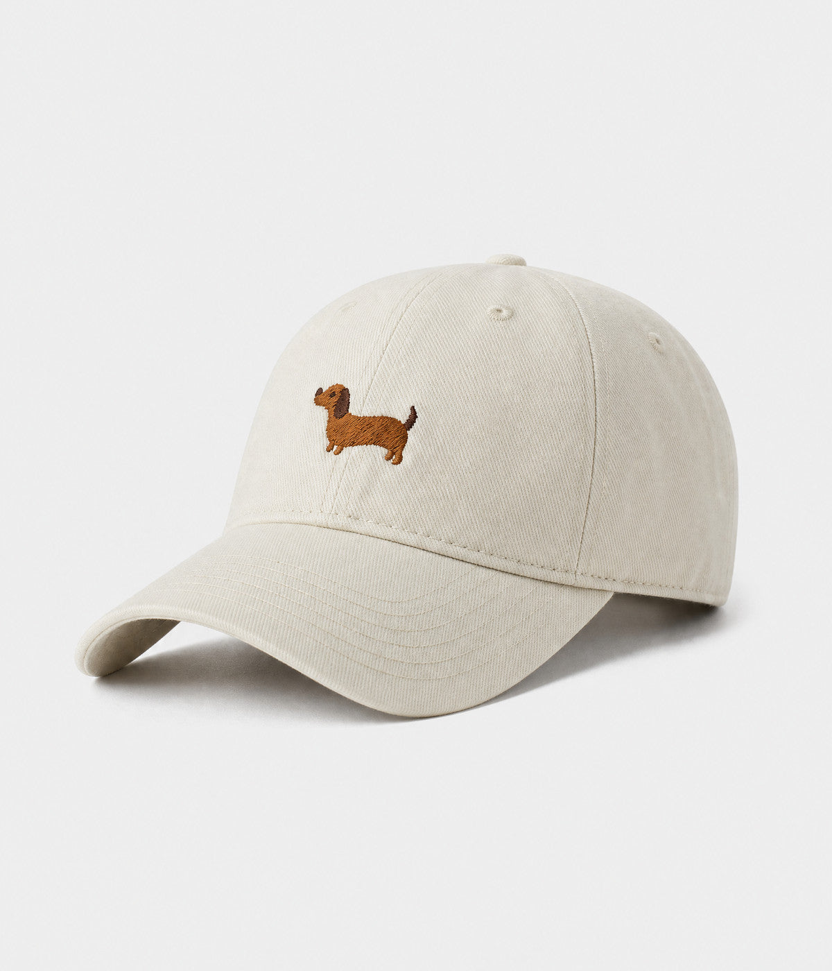 SAUSAGE DOG. washed cotton cap in white, side view