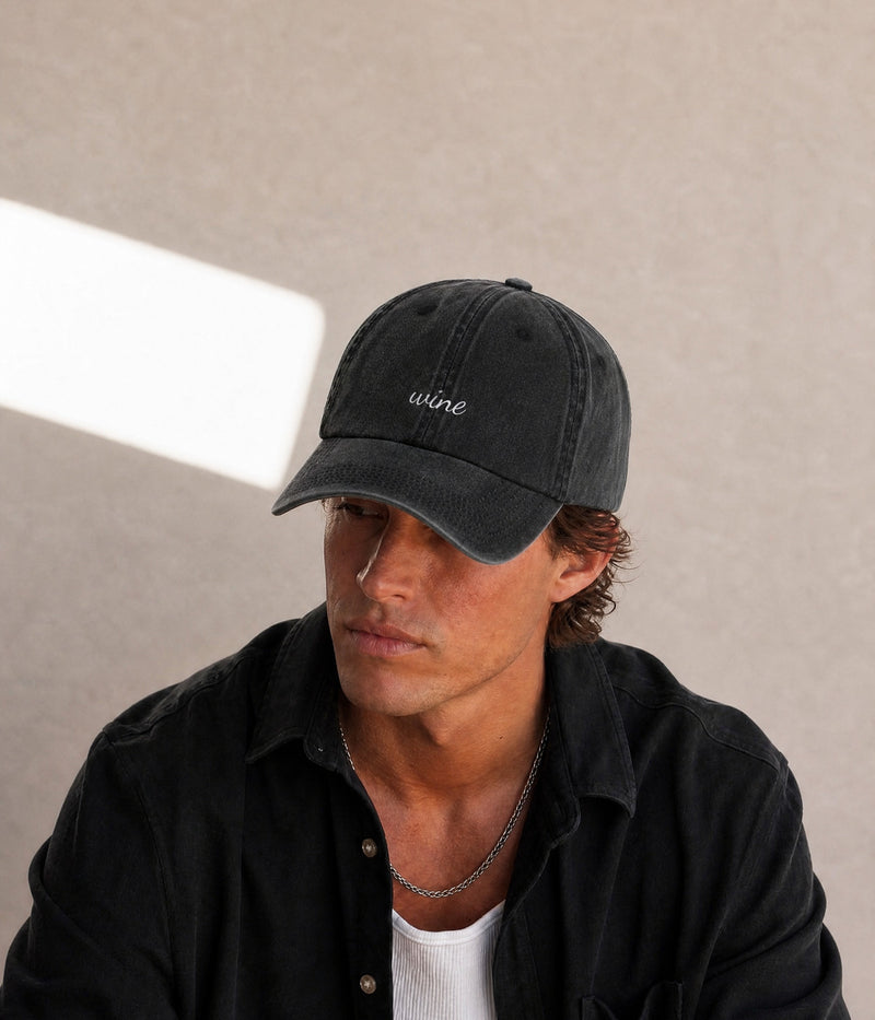 WINE - CURSIVE. BLACK worn by a man