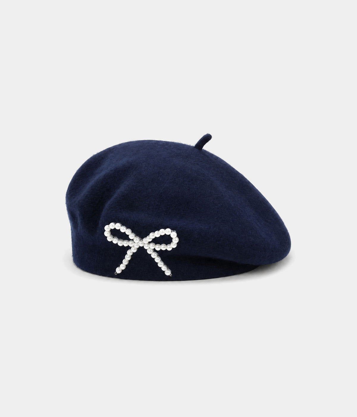 PEARL BOW BERET. wool beret in NAVY, front view