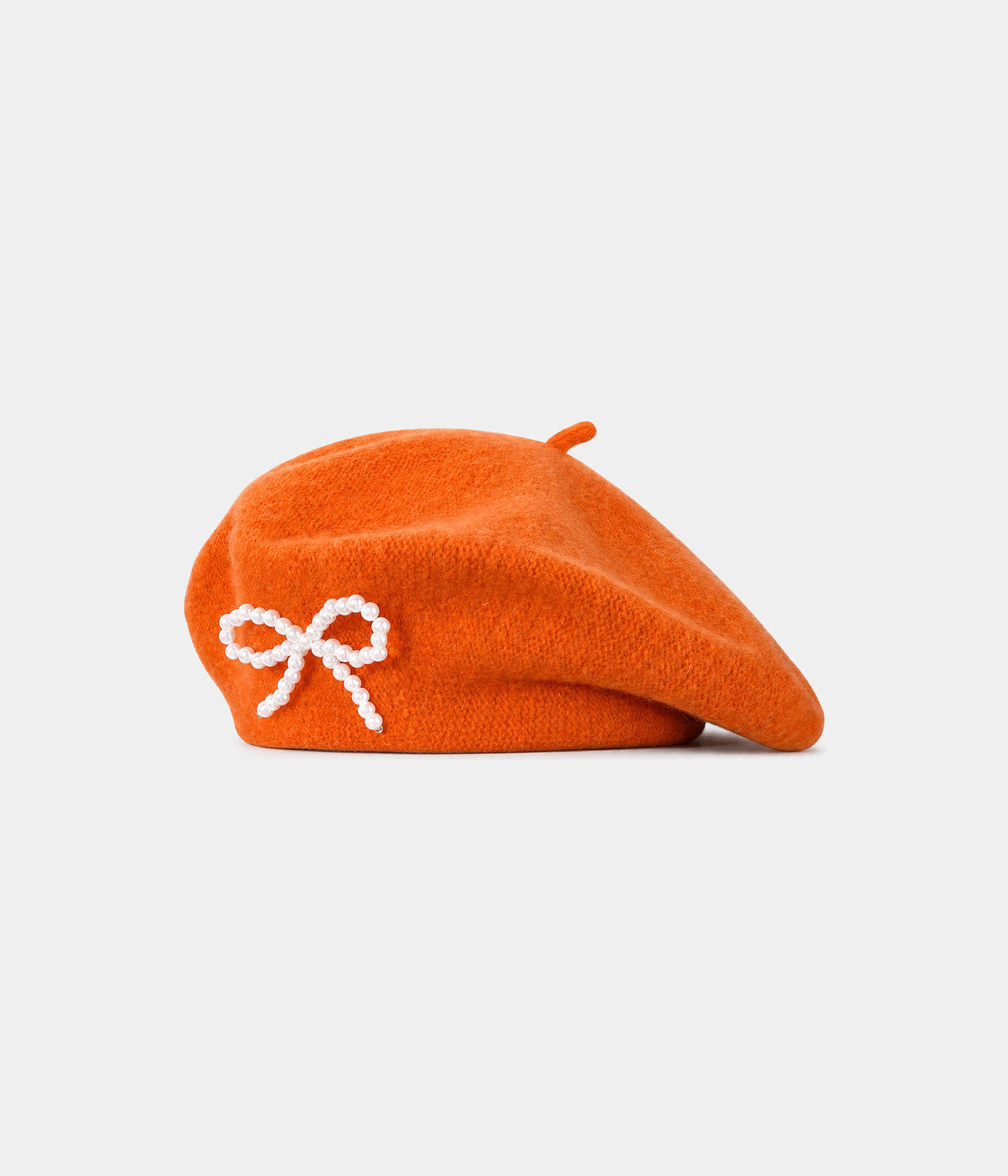 PEARL BOW BERET. wool beret in ORANGE, front view